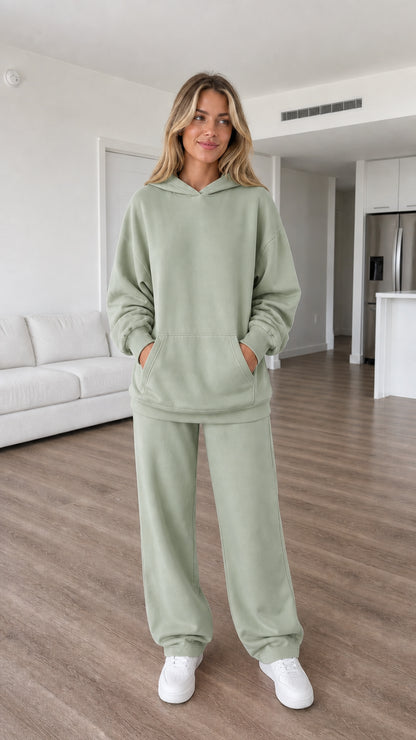 Model wearing sage green oversized hoodie and sweatpants set