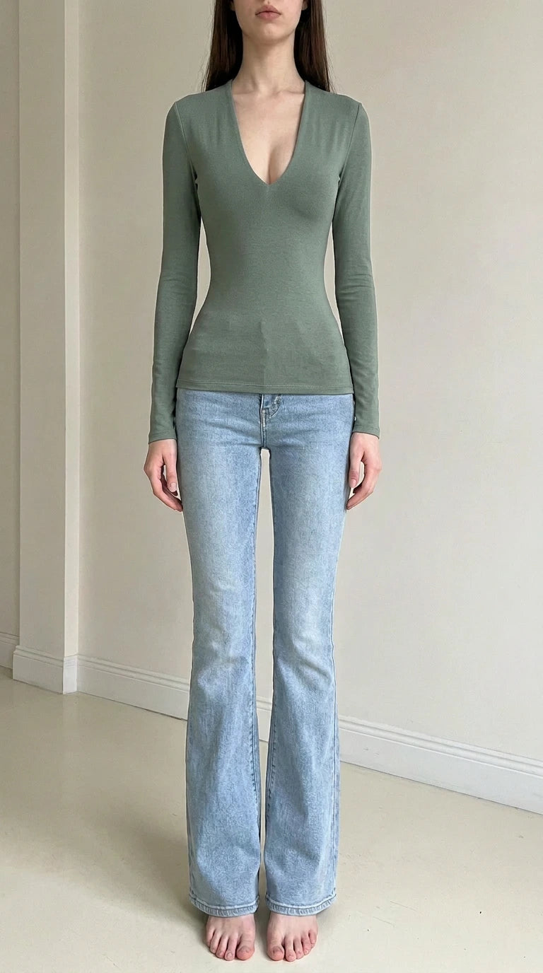 Front view of woman wearing sage green deep v-neck long sleeve top