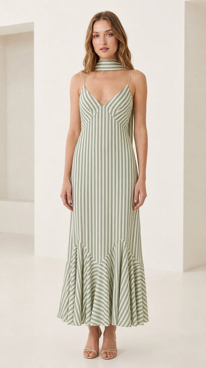 Front view of model in sage green striped cami maxi dress