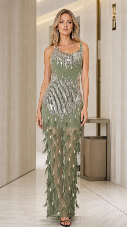 Front view of woman in sage green beaded feather maxi dress