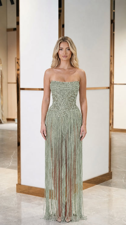 Model wearing sage green color variant of crystal fringe evening gown