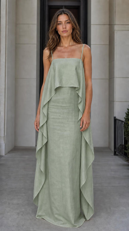 Model wearing the sage green color variant of the flowing overlay maxi dress