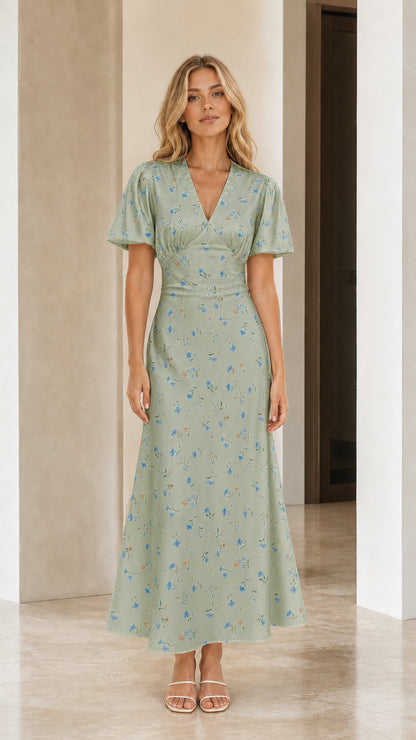 Front view of woman wearing sage green floral print maxi dress