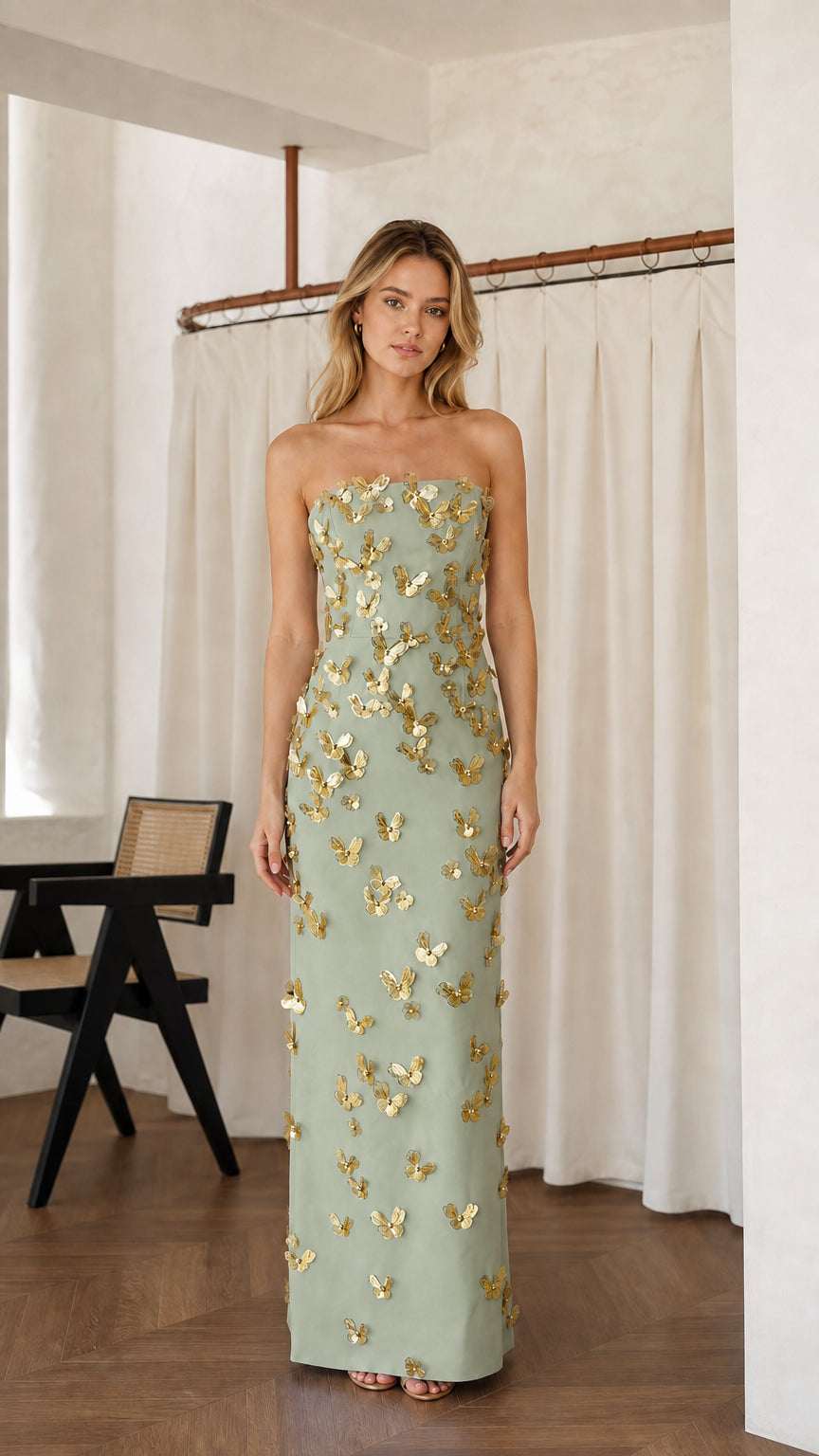 Front view of sage green strapless maxi dress with gold butterfly appliques