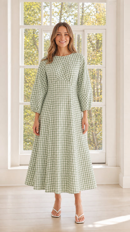 Woman wearing sage green gingham midi dress