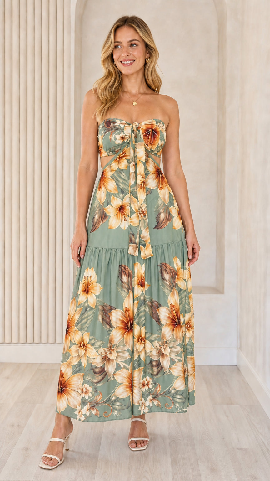 Front view of green floral strapless maxi dress