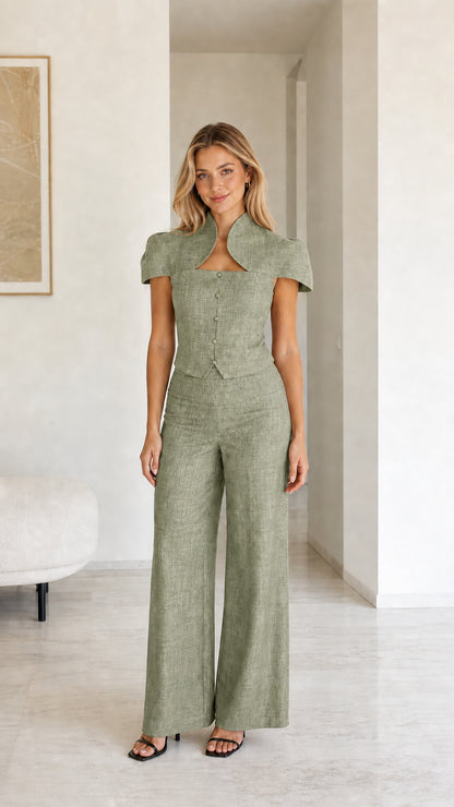 Model wearing sage green color variant of two-piece set