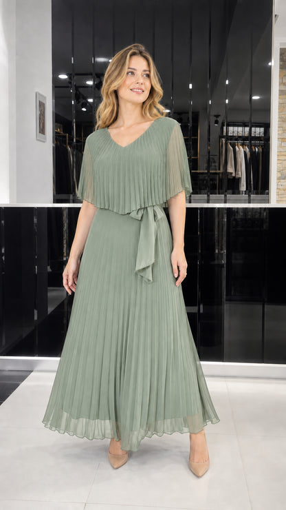 Model wearing sage green pleated cape overlay maxi dress