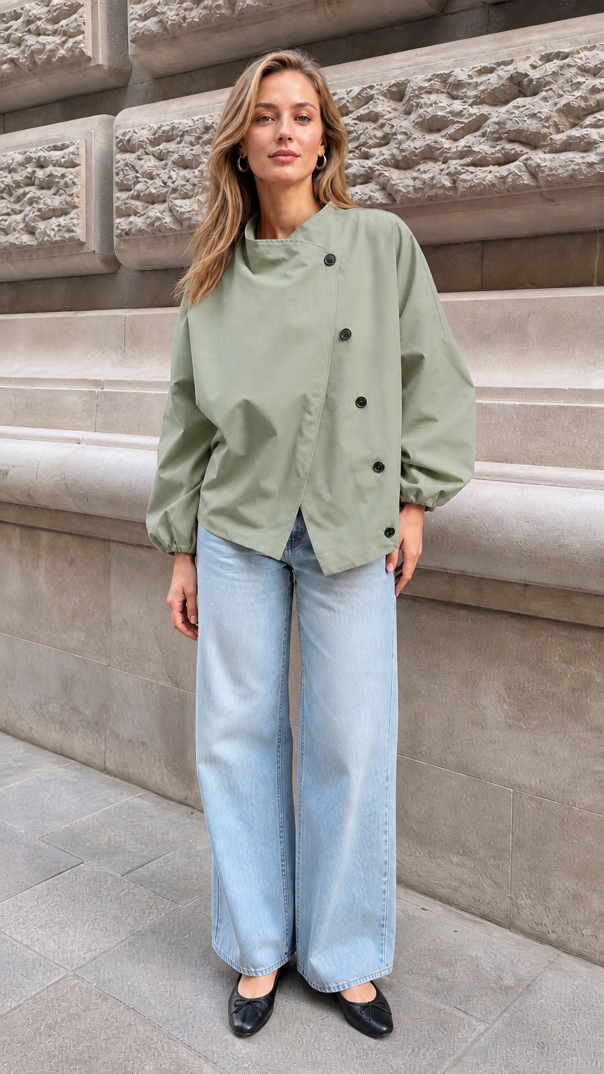Model wearing the sage green asymmetrical button balloon sleeve top