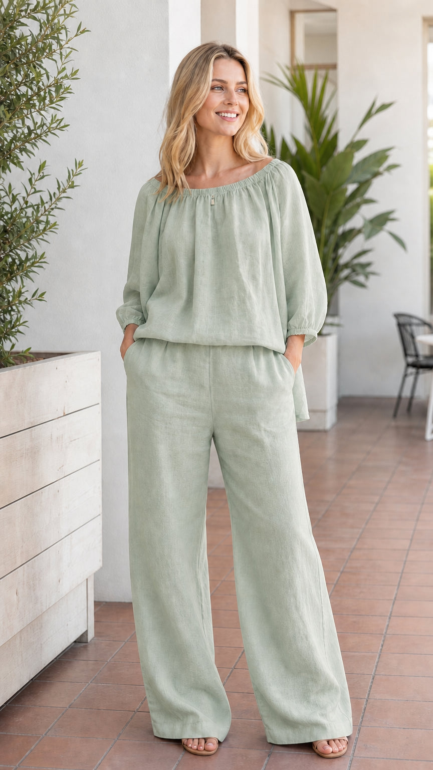 Woman wearing sage green two-piece pant set