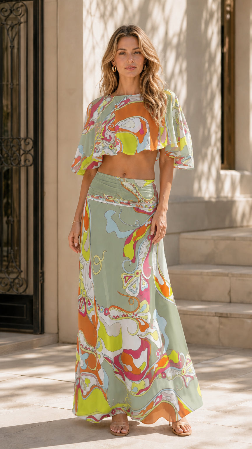 Model wearing sage green variant of the abstract print two-piece set