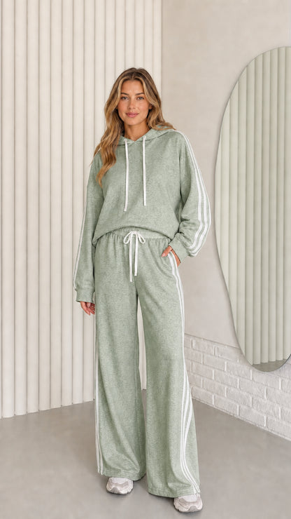 Front view of the sage green women's striped hoodie and wide-leg pants set