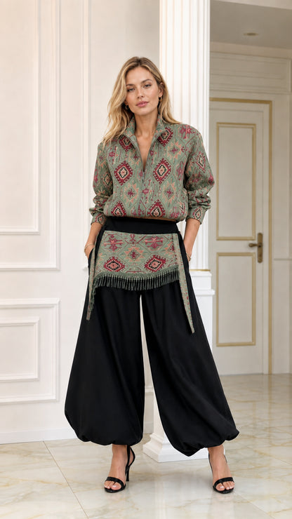 Front view of sage green geometric pattern blouse and black balloon pants two-piece set