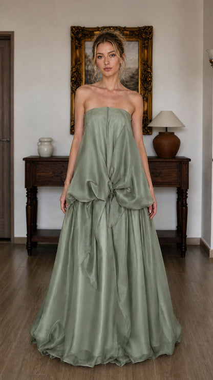 Model wearing sage green strapless tiered maxi dress