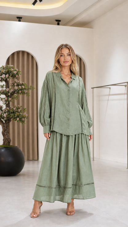 Front view of the sage green women's blouse and maxi skirt two-piece set
