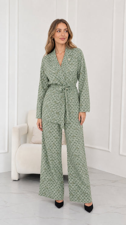 Model wearing sage green geometric print two-piece pant suit set