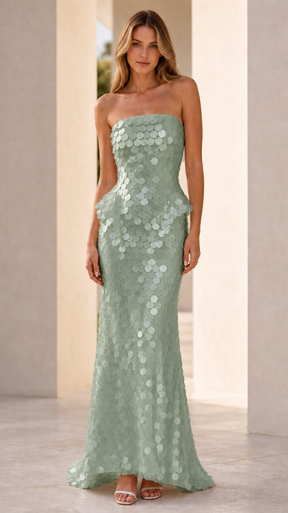 Front view of model wearing sage green sequin strapless peplum maxi dress