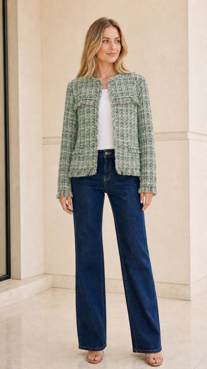 Model wearing sage green tweed jacket front view
