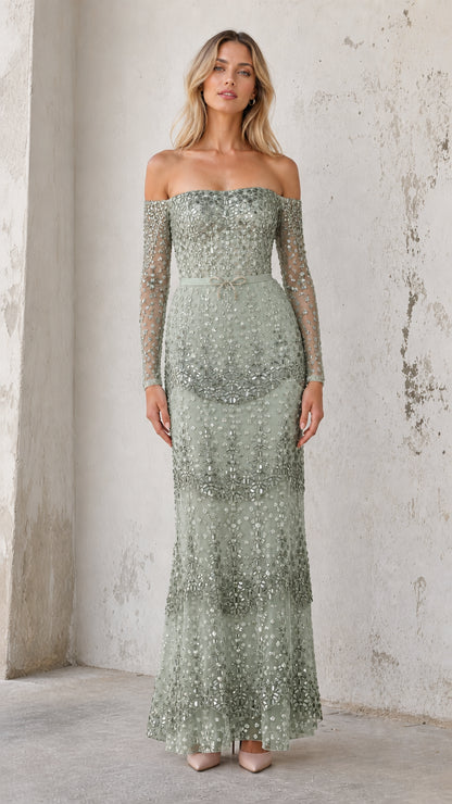 Model wearing sage green sequin off-shoulder evening gown