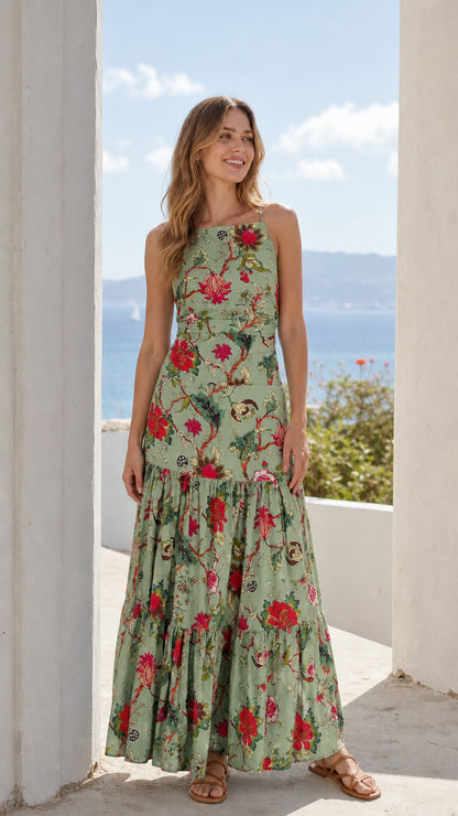 Woman wearing sage green floral tiered maxi dress