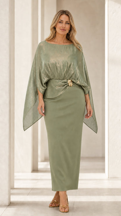 Front view of woman wearing sage green metallic cape overlay maxi dress