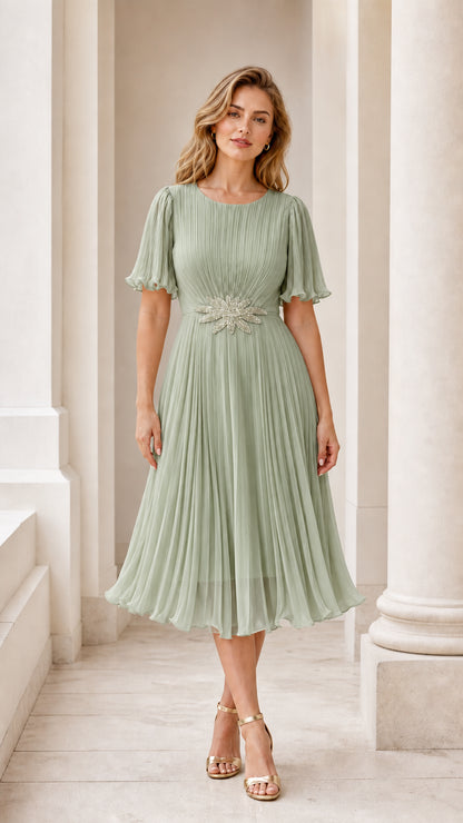 Front view of model wearing the sage green pleated midi dress