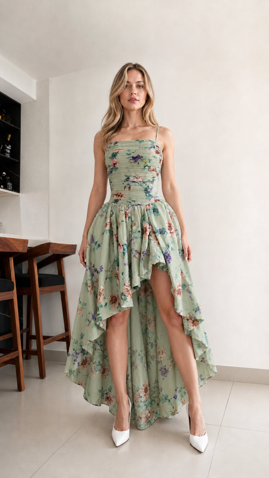 Woman wearing sage green floral high-low cami dress