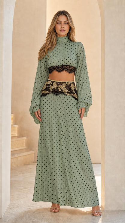 Sage green polka dot two-piece set with long sleeve crop top and high waist maxi skirt