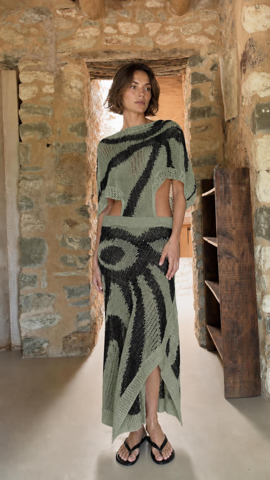Model wearing sage green open-knit two-piece maxi set
