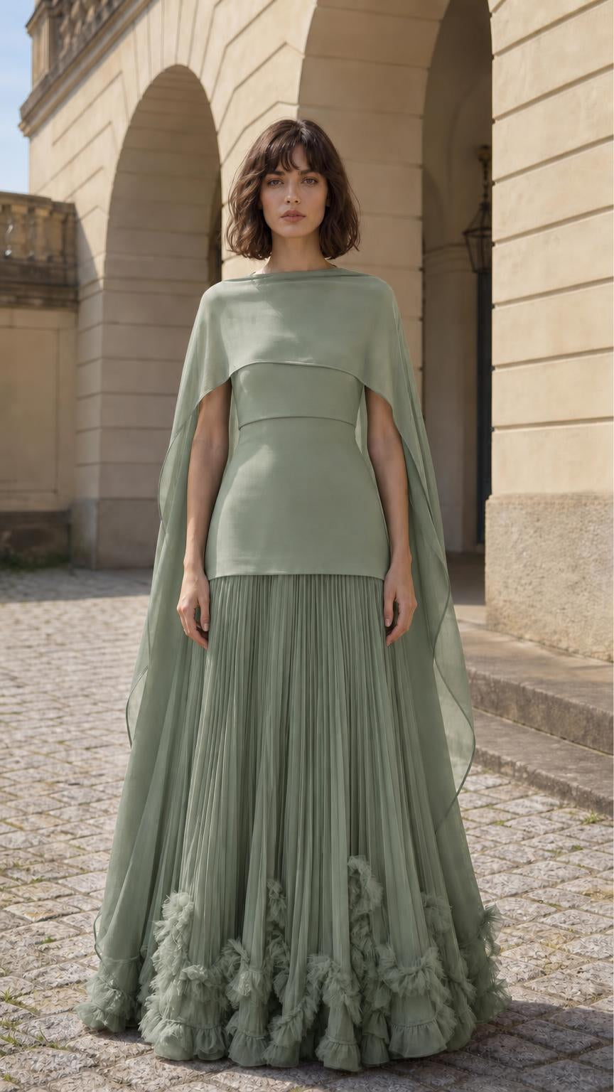 Front view of woman wearing sage cape overlay pleated maxi dress