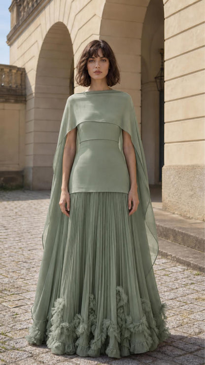 Front view of woman wearing sage cape overlay pleated maxi dress