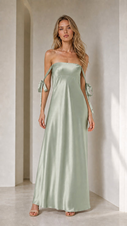 Model wearing sage green satin strapless maxi dress