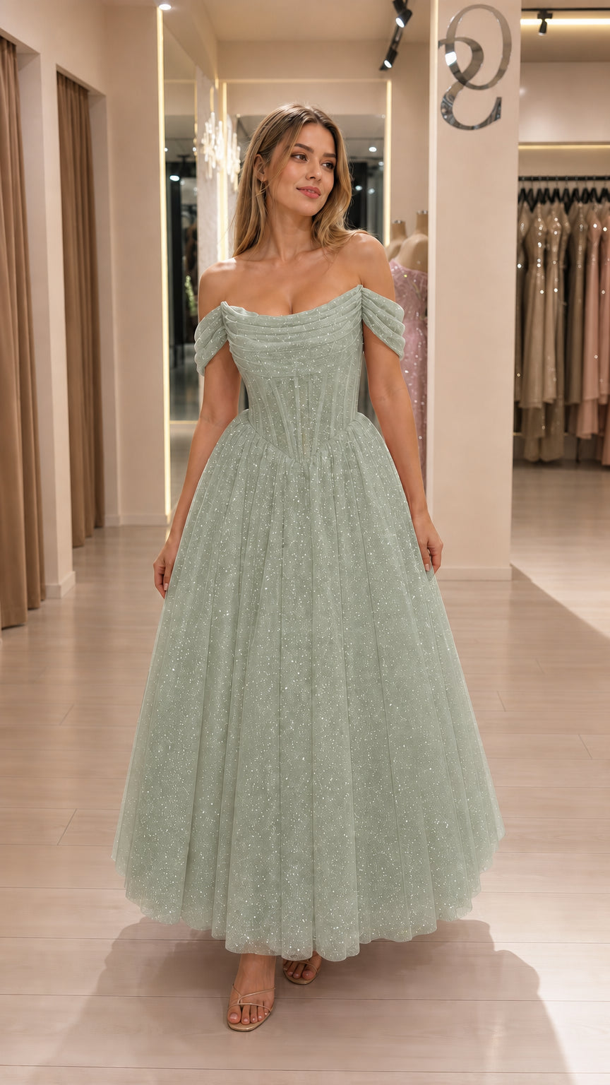 Model wearing sage green glitter tulle corset midi dress