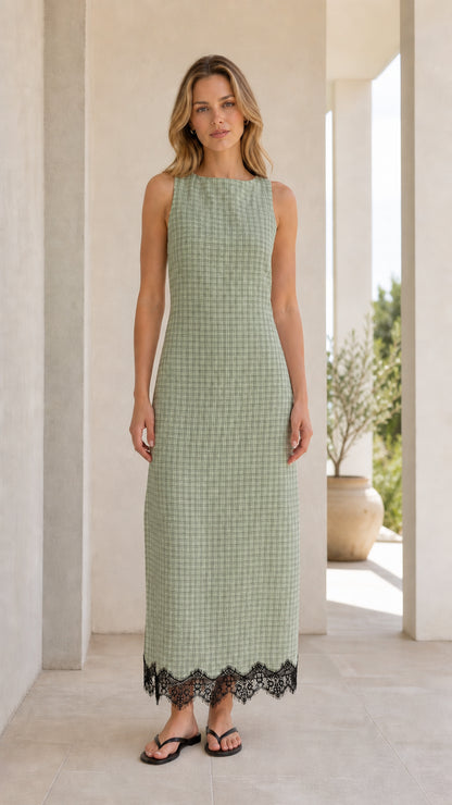 Front view of model wearing green gingham midi dress