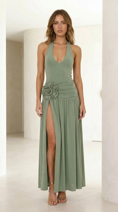 Front view of model wearing sage green halter neck maxi dress