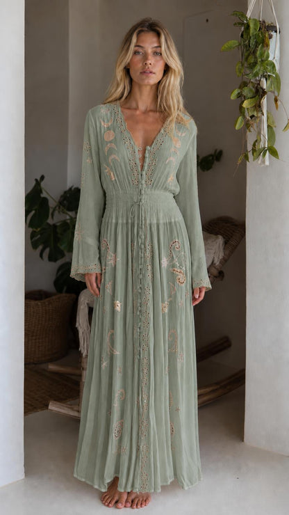 Front view of model wearing sage green celestial embroidered maxi dress