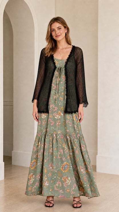 Front view of the sage green floral maxi dress with sheer black cardigan overlay
