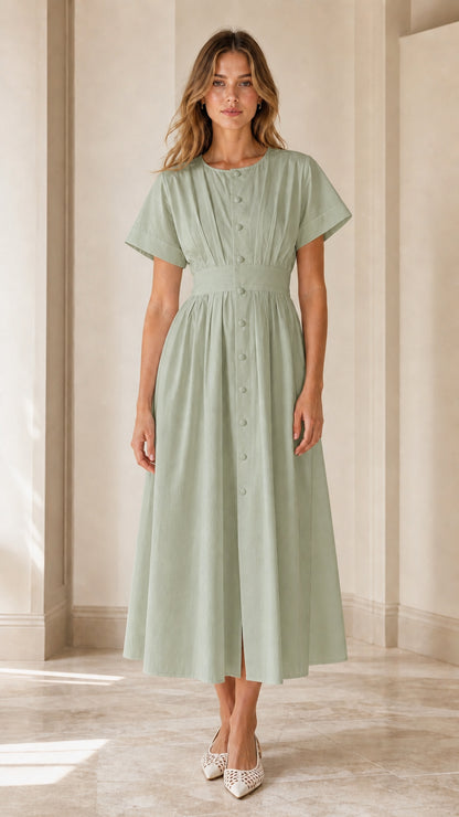Model wearing sage green pleated button-down midi dress