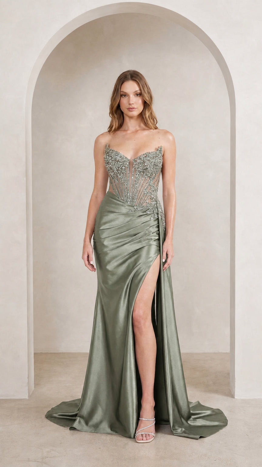 Model wearing sage green evening gown front view
