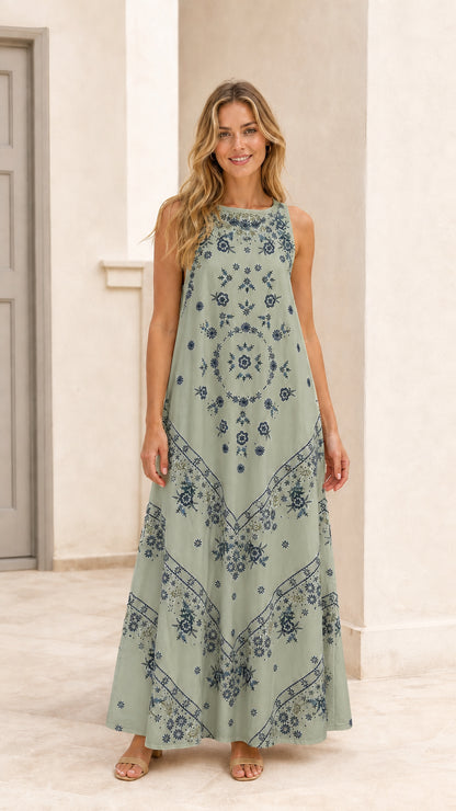 Woman wearing sage green floral embroidered sleeveless maxi dress