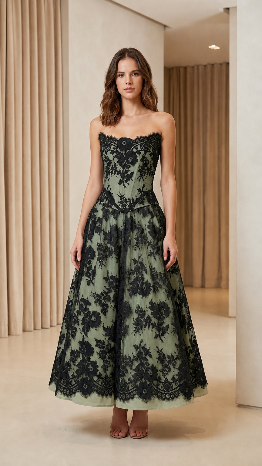 Model wearing sage green color variant of lace corset midi dress
