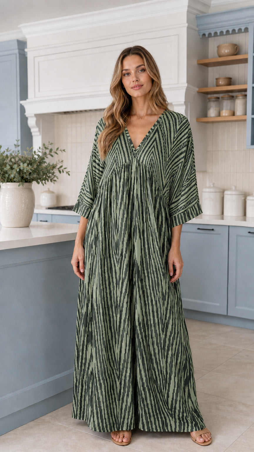 Front view of woman wearing Sage Green printed wide-leg palazzo jumpsuit