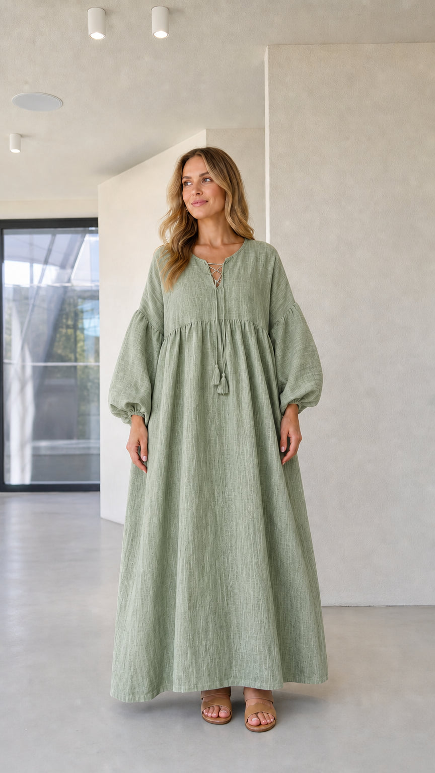 Model wearing sage green linen-look long sleeve maxi dress
