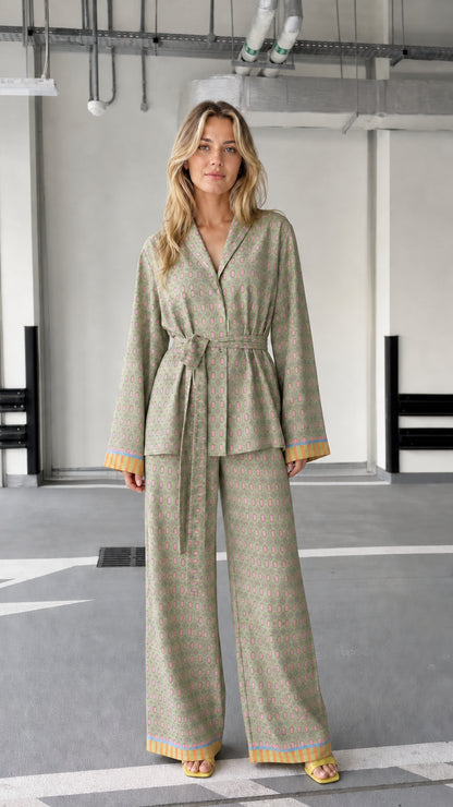 Woman wearing sage patterned two-piece lounge set