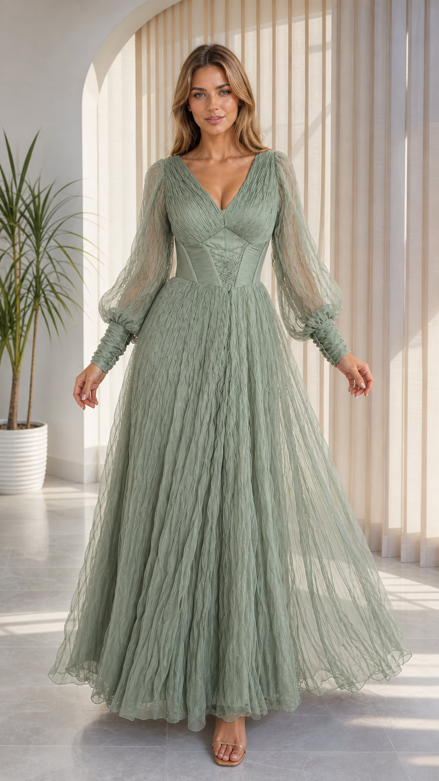 Front view of model wearing sage green pleated tulle gown with bishop sleeves