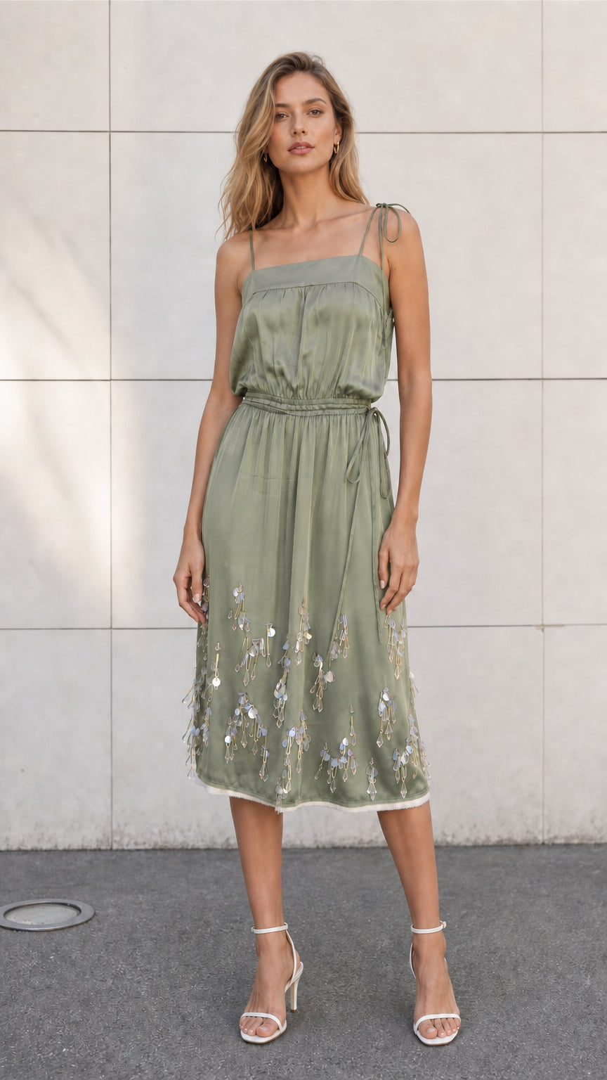 Front view of model wearing sage satin embellished midi slip dress