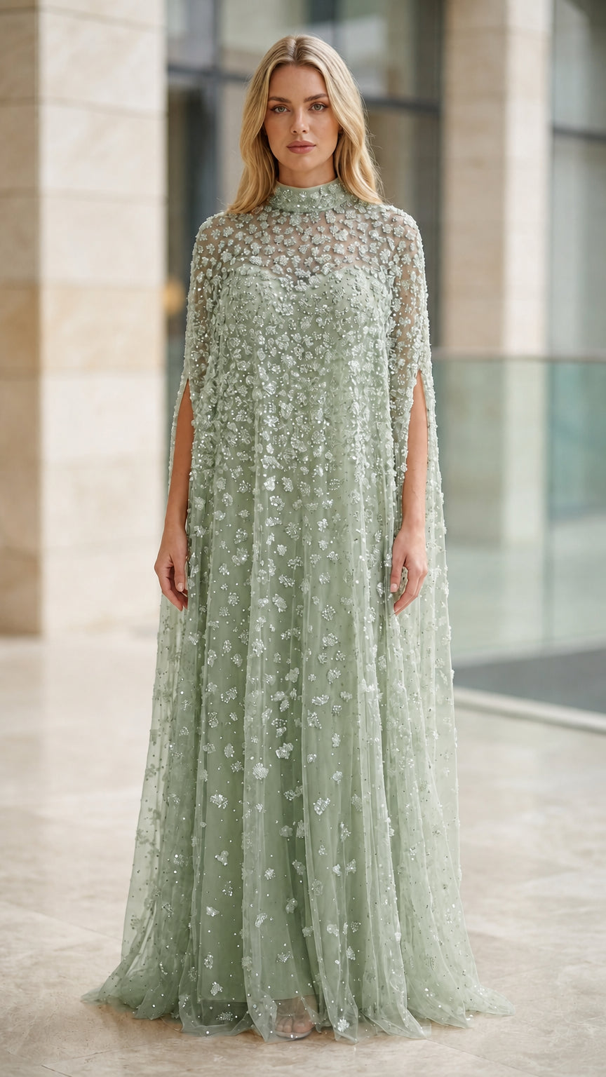 Model wearing sage green embellished cape formal maxi gown