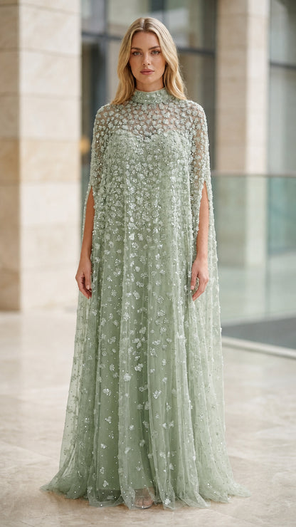 Model wearing sage green embellished cape formal maxi gown