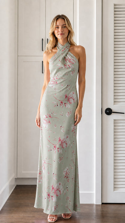 Front view of model wearing sage green floral halter neck maxi dress