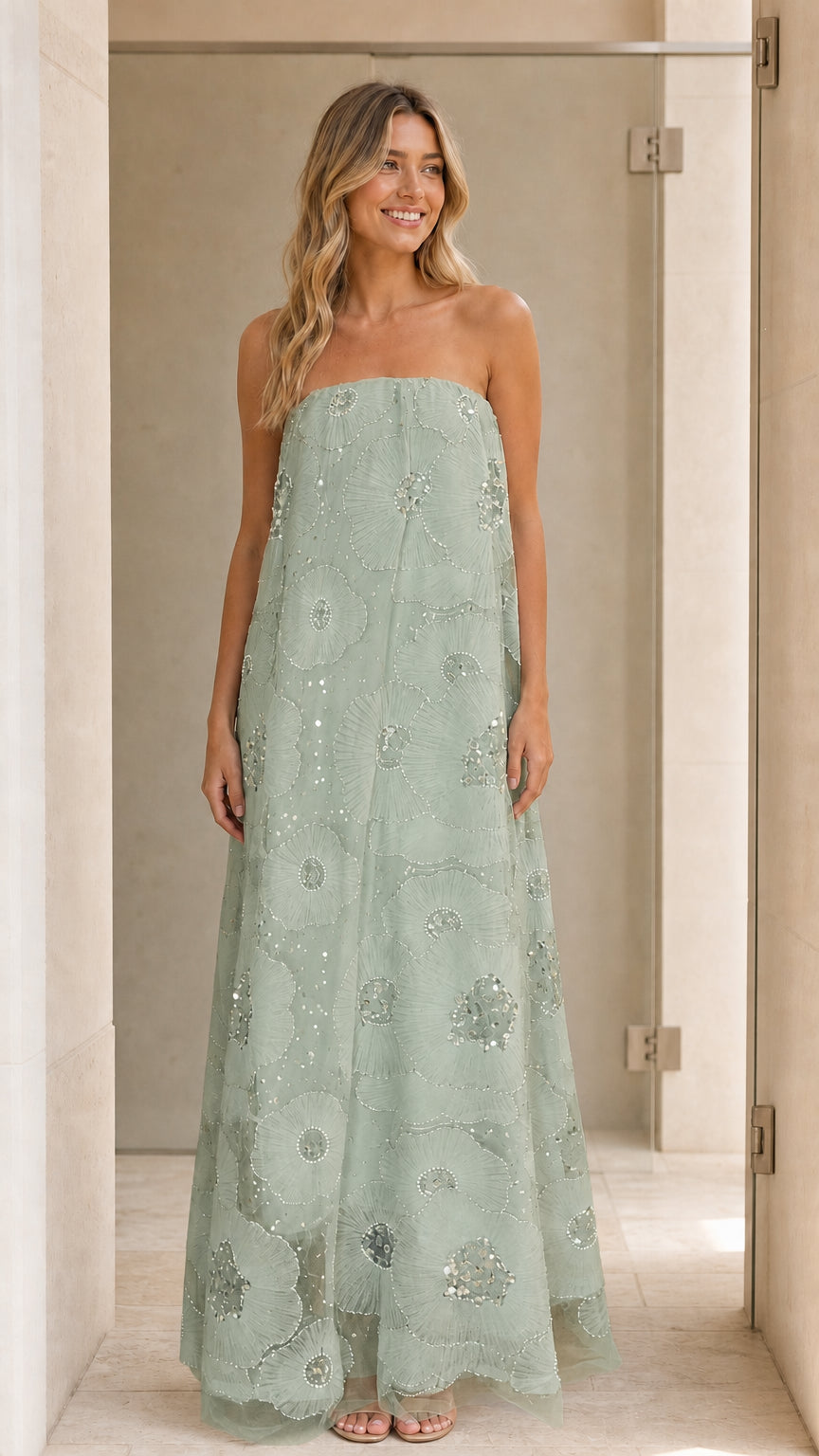 Model wearing sage green strapless sequin floral maxi dress